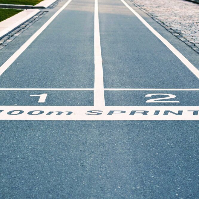 Close-up of outdoor 100m sprint track lanes, perfect for athletics and sprinting events.