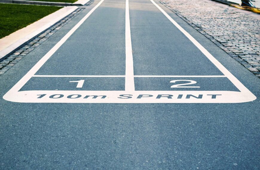 Close-up of outdoor 100m sprint track lanes, perfect for athletics and sprinting events.